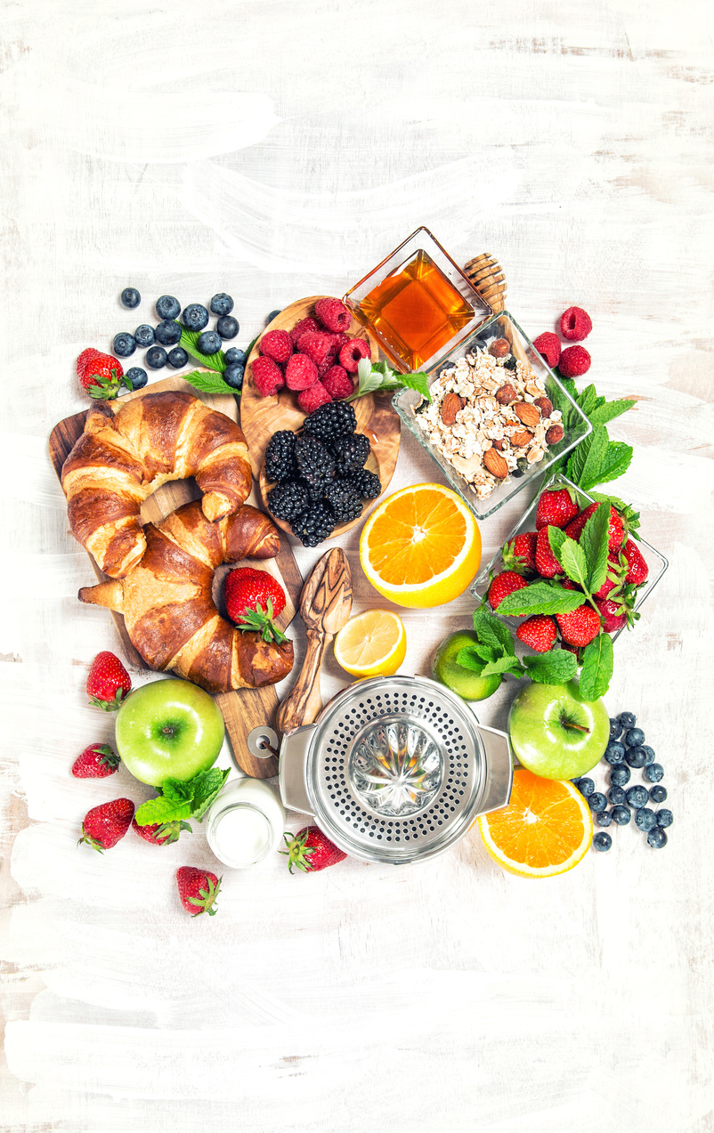 Breakfast table croissants berries fruits Healthy food drink